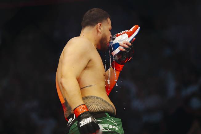 Tai Tuivasa drinks a beer from a shoe after knocking out Greg Hardy during their UFC 264 heavyweight bout at T-Mobile Arena Saturday, July 10, 2021.
