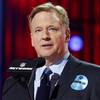 In this April 29, 2021, file photo, NFL commissioner Roger Goodell, wearing a COVID-19 vaccinated sticker, speaks during the first round of the NFL football draft in Cleveland. The NFL has informed teams they could potentially forfeit a game due to a COVID-19 outbreak among non-vaccinated players and players on both teams wouldn’t get paid that week. Commissioner Goodell said Thursday, July 22, 2021, in a memo sent to clubs that was obtained by The Associated Press that the league doesn’t anticipate adding a 19th week to accommodate games that can’t be rescheduled within the 18-week regular season. 