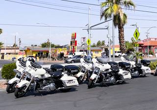 A line of police motorcycles is parked near the crosswalk at N. Eastern Avenue and Hinkle Drive as officers stepped up enforcement and reminded drivers of increased pedestrian traffic as children return to school next week in Las Vegas on Aug. 4, 2021. (Photo by Casey Harrison/Las Vegas Sun)