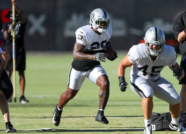 Las Vegas Raiders running back Josh Jacobs (28) carries the ball during the Raiders Training Camp at the Intermountain Healthcare Performance Center in Henderson Friday, Aug. 6, 2021. STEVE MARCUS