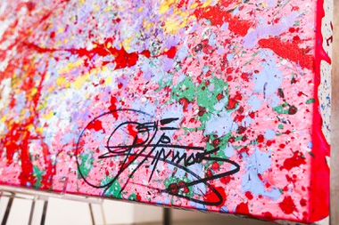 KISS singer and musician, Gene Simmons’ signature is seen on one of his paintings currently on display at Animazing Gallery inside the Grand Canal Shoppes at the Venetian, Thursday, Aug. 5, 2021. The pieces in Gene Simmons ArtWorks will be publicly debuted from Oct. 14 to 16, with a private opening-day reception and two days of public presentations. YASMINA CHAVEZ