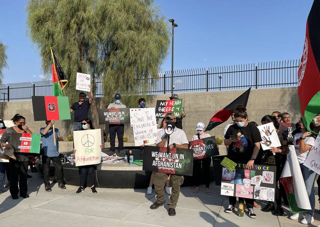 Protesters are shown outside the Lloyd D. George U.S. Courthouse in downtown Las Vegas Tuesday, Aug. 17, 2021, to speak out for those in Afghanistan facing a humanitarian crisis after the Taliban's speedy takeover. 

