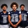 Members of the Shadow Ridge High School football team are pictured during the Las Vegas Sun's high school football media day at the Red Rock Resort on August 3rd, 2021. They include, from left, Mason White, Devon Woods and Bryce Evans.