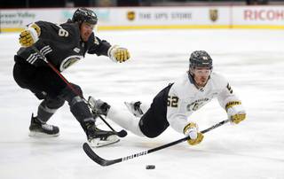 Dylan Coghlan (52) gets tripped up by Ben Thomson (86) during Vegas Golden Knights Training Camp at City National Arena in Henderson Friday, Sept. 24, 2021. 