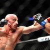 UFC featherweight champion Alexander Volkanovski, left, connects with a punch on Brian Ortega during UFC 266 at T-Mobile Arena Saturday, Sept. 25, 2021. Volkanovski retained his title by unanimous decision.