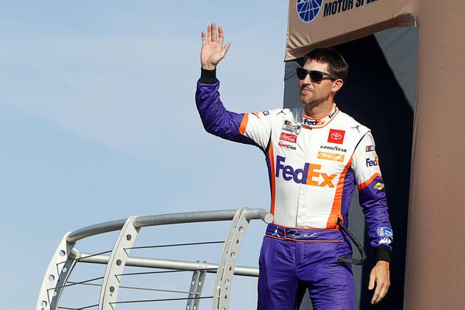 NASCAR Cup Series driver Denny Hamlin (11) waves during driver introductions before a NASCAR Cup Series auto race at the Las Vegas Motor Speedway Sunday, Sept. 26, 2021, in Las Vegas. Hamlin won the race.