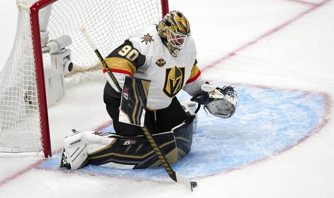 Golden Knights goalie Robin Lehner makes a stick save of a shot while facing the Colorado Avalanche in the first period of an NHL hockey game Tuesday, Oct. 26, 2021, in Denver. 