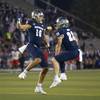 Nevada's Cole Turner (19) and Jacques Badolato-Birdsell (23) celebrate after a touchdown against UNLV during the first half of an NCAA college football game in Reno, Friday, Oct. 29, 2021. Nevada's Cole Turner (19) and Jacques Badolato-Birdsell (23) celebrate after a touchdown against UNLV during the first half of an NCAA college football game in Reno, Friday, Oct. 29, 2021.