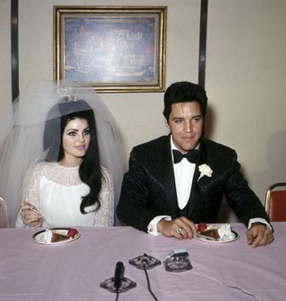 Elvis Presley and Priscilla Beaulieu eat cake during their news conference after their wedding at the Aladdin May 1, 1967, in Las Vegas. (Las Vegas News Bureau)