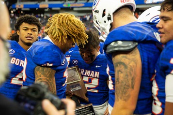 Bishop Gorman High School celebrates their 56-7 win against McQueen High of Reno in the 5A high school football championship at Allegiant Stadium on Thursday Nov. 18, 2021.