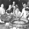 People are shown at one of the gaming tables at the Flamingo in Las Vegas on May 24, 1955. 