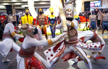 KA cast members battle during a pop-up performance in the hotel lobby celebrating the return of KA by Cirque Du Soleil at MGM Grand Wednesday, Nov. 24, 2021.