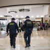 Police officers on patrol at the Westfield Garden State Plaza, a shopping mall in Paramus, N.J., on Black Friday, Nov. 26, 2021. Theft is an ever-present issue for retailers, but it has become more visible, brazen and violent in recent months. 
