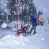 This photo provided by Mammoth Lakes Tourism shows snow being cleared along the street in the Town of Mammoth Lake, Calif., during heavy snowfall on Thursday, Dec. 9, 2021. A second, much stronger winter storm is headed for the Sierra this weekend after a cold front dropped a half-foot (15 centimeters) of snow at Lake Tahoe ski resorts and a couple inches (5 cm) fell early Wednesday in the valleys around Reno. 