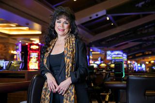 Beverage server Marie Archuletta poses on the casino floor at Green Valley Ranch in Henderson Thursday, Dec. 16, 2021. Archuletta started work for Station Casinos at Palace Station, then helped open Boulder Station and GVR.