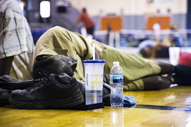 A man rests at the Dula Community Center Monday, July 12, 2021. The community center was turned into a cooling center for people trying to get out of the record-breaking heat. YASMINA CHAVEZ
