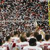 Wisconsin players hoist the championship trophy after defeating Arizona State, 20-13, during the SRS Distribution Las Vegas Bowl at Allegiant Stadium Thursday, Dec. 30, 2021.