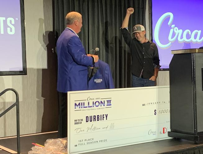 Circa Sports CEO Derek Stevens presents a $1 million check to California resident Tony Gordon. Gordon posted a 63-27 record in selecting NFL games against the points spread to win the Circa Sports Million III contest.