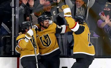 Vegas Golden Knights defenseman Shea Theodore, center, celebrates with Jonathan Marchessault. left, and Nicolas Roy (10) after scoring the winning goal in overtime against the Montreal Canadiens at T-Mobile Arena Thursday, Jan. 20, 2022. 