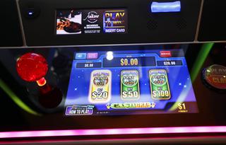 A screen displays payouts at different betting levels on a claw machine by Aruze Gaming at Circa in downtown Las Vegas Thursday, Jan. 27, 2022.