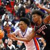 Bishop Gorman's Darrion Williams (5) and Liberty's Joshua Jefferson (5) chase after a loose ball during a game at Liberty High School Thursday, Jan. 27, 2022.