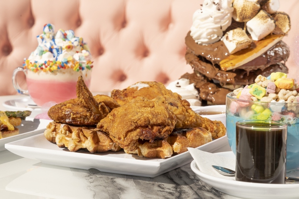 From left: The Sugar Factory Eggs Benedict, Pink Unicorn Hot Chocolate, Chicken and Waffles, Banana Nutella Lovers Pancakes, and the Lucky Charm Blue Latte at Sugar Factory on Harmon Corner, Thursday, Feb. 10, 2022. YASMINA CHAVEZ