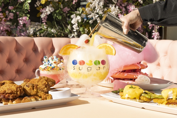 From left: Chicken and Waffles, Pink Unicorn Hot Chocolate,  Mimosa Popsicle Goblet, Pink Cloud Pancake Stack, and the  Sugar Factory Eggs Benedict  at Sugar Factory on Harmon Corner, Thursday, Feb. 10, 2022. YASMINA CHAVEZ
