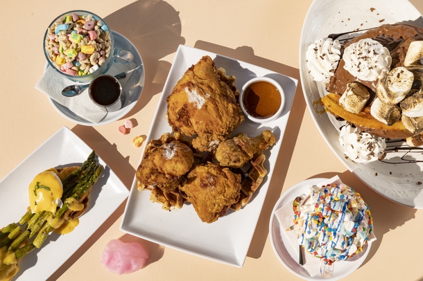 From left: The Sugar Factory Eggs Benedict, Lucky Charm Blue Latte, Chicken and Waffles, the Pink Unicorn Hot Chocolate and the Banana Nutella Lovers Pancakes at Sugar Factory on Harmon Corner, Thursday, Feb. 10, 2022. YASMINA CHAVEZ