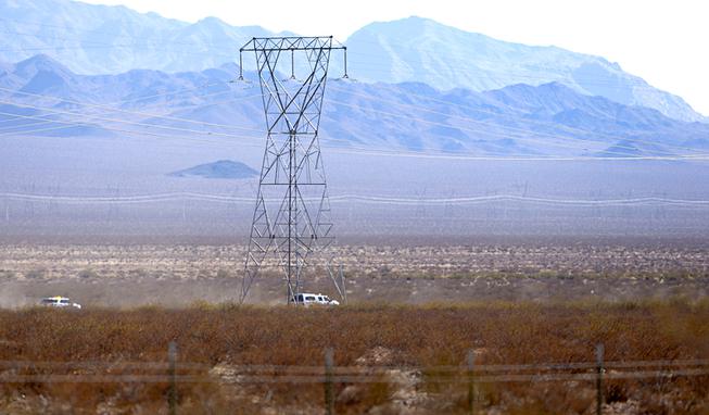 Boulder City Police vehicles drive through desert near U.S. 95 after a fatal small plane crash in the desert south of the Boulder City Municipal Airport and east of U.S. 95 Thursday, Feb. 24, 2022. 