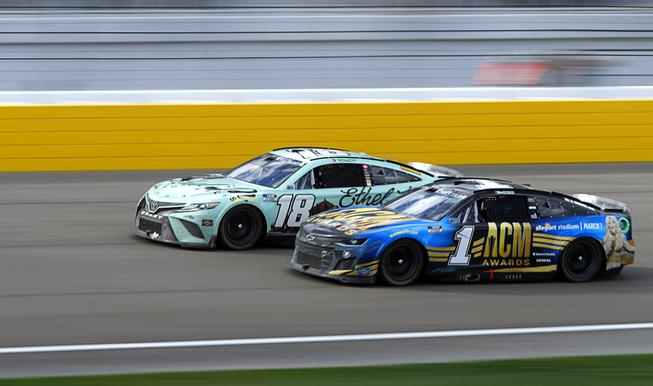 NASCAR Cup Series drivers Kyle Busch (18) and Ross Chastain (1) during the 25th annual Pennzoil 400 NASCAR Cup Series race at the Las Vegas Motor Speedway Sunday, March 6, 2022.