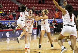 UNLV Lady Rebels celebrate their 75-65 victory over the Colorado State Rams in the Mountain West womens championship game at the Thomas & Mack Center Wednesday, March 9, 2022. From left: guard Essence Booker (24), forward Khayla Rooks (20) and forward Nneka Obiazor (1).