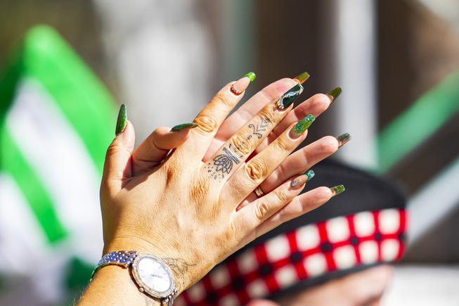 An attendee with festive nails claps during the St. Patricks Day Celtic Feis celebration at the New York New York Hotel and Casino Thursday, March 17, 2022. YASMINA CHAVEZ