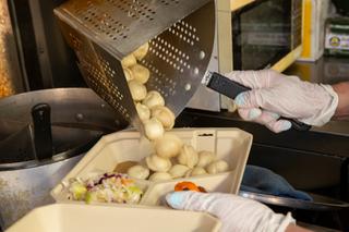 Ellen Doren prepares Pelmeni, Siberian style meat dumplings, inside her Eastern European food truck Kolobok Fri. March 18, 2022. 10% of their sales will be donated to World Central Kitchen to help feed Ukrainian refugees.