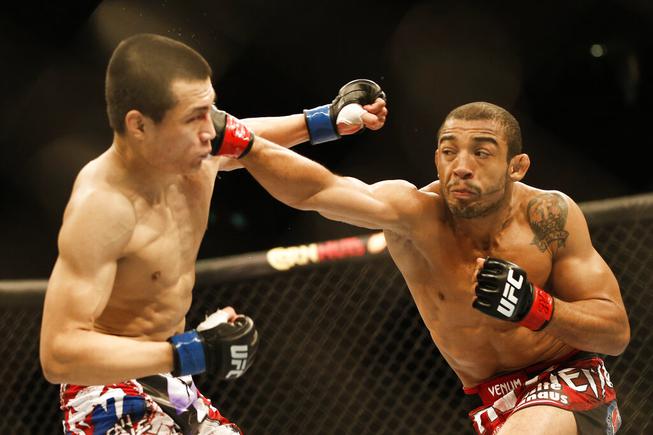 In this Aug. 4, 2013, file photo, Jose Aldo, from Brazil, right, and Chan Sung Jung, from South Korea, battle during their mixed martial arts Featherweight Championship bout in Rio de Janeiro, Brazil.