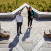 Jay Poster, founder and general manager of King David Memorial Chapel and Cemetery and Celena DiLullo, president of Palm Mortuaries, pose for a photo at the Holocaust Memorial Plaza at King David Memorial Chapel and Cemetery Thursday, April 21, 2022.
