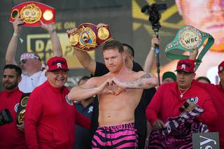 Canelo Alvarez motions to the crowd during a ceremonial boxing weigh-in, Friday, May 6, 2022, in Las Vegas. Alvarez is scheduled to fight Dmitry Bivol Saturday in Las Vegas.