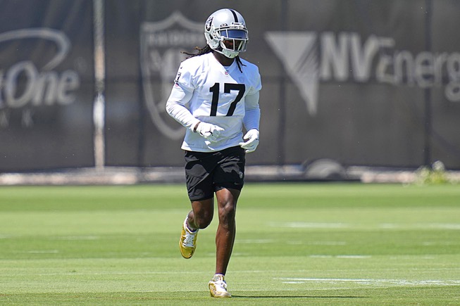 Las Vegas Raiders wide receiver Davante Adams warms up at the NFL football team's practice facility Wednesday, June 8, 2022, in Henderson, Nev.