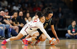 Washington Mystics forward Alysha Clark (22) and Las Vegas Aces forward Dearica Hamby (5) fight for a loose ball during the first half of a WNBA basketball game at the Michelob Ultra Arena in Mandalay Bay Saturday, June 25, 2022.