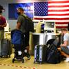 Travelers check in at the Philadelphia International Airport ahead of the Independence Day holiday weekend in Philadelphia, Friday, July 1, 2022. The July Fourth holiday weekend is off to a booming start with airport crowds crushing the numbers seen in 2019, before the pandemic.