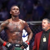 UFC middleweight champion Israel Adesanya stands in the Octagon after five rounds against  Jared Cannonier during UFC 276 at T-Mobile Arena Saturday July 2, 2022.