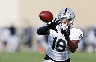Las Vegas Raiders wide receiver Jordan Veasy (18) catches a pass during the teams first fully padded practice during training camp at the Las Vegas Raiders Headquarters/Intermountain Healthcare Performance Center in Henderson Wednesday,  July 27, 2022.