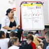 Lidia Sibrian teachers a kindergarten class at Harley A Harmon Elementary School on the first day of school Monday, Aug. 8, 2022.