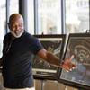 Pro Football Hall of Famer Emmitt Smith looks over artist renderings of his restaurant at the Fashion Show Mall Thursday, Aug. 18, 2022. Emmitts Las Vegas, a 30,000+ sq. ft. restaurant and event venue, is expected to open at the mall near the end of 2022 of early 2023.
