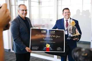 Principal Ryan Cordia, right, receives the School Administrator of the Year award from Clark County School District Superintendent Jesus Jara at Southeast Career Technical Academy Friday, Aug. 19, 2022.