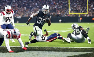 Las Vegas Raiders running back Brittain Brown (38) scores a touchdown during the second half of an NFL preseason football game against the New England Patriots at Allegiant Stadium Friday, Aug. 26, 2022.