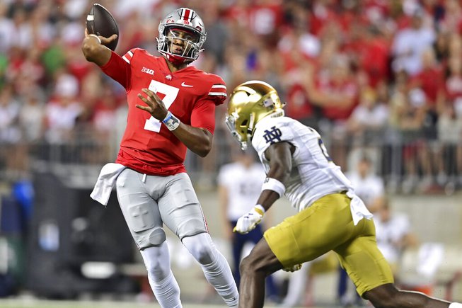Ohio State quarterback C.J. Stroud throws while being pressured by Notre Dame safety DJ Brown during the second quarter of an NCAA college football game Saturday, Sept. 3, 2022, in Columbus, Ohio. 



