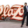 Jonathan Jossel, CEO of The Plaza, flips a switch to reilluminate a historic Plaza sign during a private ceremony at the Neon Museum, downtown, Wednesday.