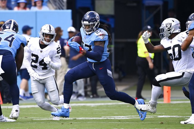 Tennessee Titans running back Derrick Henry (22) carries the ball against the Las Vegas Raiders in the first half of an NFL football game Sunday, Sept. 25, 2022, in Nashville, Tenn. 


