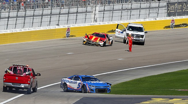 NASCAR Cup Series driver Bubba Wallace (45) walks across the race track after colliding with Kyle Larson (5) during the South Point 400 NASCAR Sprint Cup auto race at the Las Vegas Motor Speedway Sunday, Oct. 16, 2022.