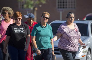 Pat Spearman, center, a Democratic state senator and candidate for North Las Vegas mayor, arrives with family, friends and supporters for a news conference at the Vegas Community Correctional Center in North Las Vegas Friday, Oct. 21, 2022. Spearman discussed the arrest of her son on charges, including attempted murder, following a shooting at her North Las Vegas home on Thursday night.